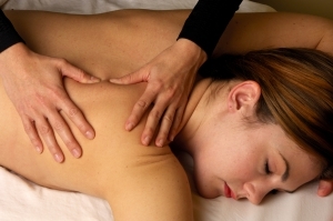 Massaging Shoulder at Mind and Body Boutique